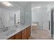 Bathroom featuring a double sink vanity with matching framed mirror and tiled floor at 3208 Fifth Baxter Xing, Fort Mill, SC 29708