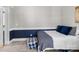Comfortable bedroom features a cozy bed with blue accents, desk setup, and soft carpeting, creating a relaxed atmosphere at 3208 Fifth Baxter Xing, Fort Mill, SC 29708
