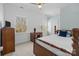 Bedroom with wood paneling, two large windows, and vintage-style furniture at 3208 Fifth Baxter Xing, Fort Mill, SC 29708