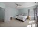 Bright bedroom with a ceiling fan, a large window and soft blue walls at 3208 Fifth Baxter Xing, Fort Mill, SC 29708
