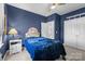 Cozy bedroom with a floral headboard and navy blue accent wall at 3208 Fifth Baxter Xing, Fort Mill, SC 29708