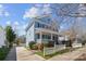Charming two-story home with a inviting porch, a white picket fence and mature landscaping at 3208 Fifth Baxter Xing, Fort Mill, SC 29708