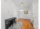 Bright foyer featuring hardwood floors, fresh paint, complemented by elegant trim, leading to the staircase and main living areas at 3208 Fifth Baxter Xing, Fort Mill, SC 29708