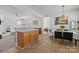 Open-concept kitchen and dining area featuring a breakfast bar and modern finishes at 3208 Fifth Baxter Xing, Fort Mill, SC 29708