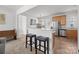 Stylish kitchen featuring a breakfast bar, stainless steel appliances, and tile flooring at 3208 Fifth Baxter Xing, Fort Mill, SC 29708