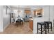 Eat-in kitchen with stainless steel appliances, breakfast bar, and a dining area at 3208 Fifth Baxter Xing, Fort Mill, SC 29708