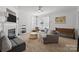 Bright and airy living room featuring a fireplace, and large windows that bring in ample natural light at 3208 Fifth Baxter Xing, Fort Mill, SC 29708