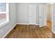 Bedroom featuring hardwood floors, a closet, and natural light at 325 Oregon St, Charlotte, NC 28208