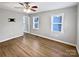 Bedroom featuring hardwood floors, a ceiling fan, and neutral paint at 325 Oregon St, Charlotte, NC 28208