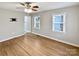 Bedroom featuring hardwood floors, a ceiling fan, and neutral paint at 325 Oregon St, Charlotte, NC 28208