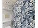 Stylish bathroom with tiled walls, a floral shower curtain, and a storage shelf at 3350 Bonneville Dr, Charlotte, NC 28205