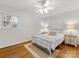 Bright bedroom with hardwood floors, a white bed frame, and neutral decor at 3350 Bonneville Dr, Charlotte, NC 28205