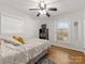 Comfortable bedroom with hardwood floors, a ceiling fan, and natural lighting at 3350 Bonneville Dr, Charlotte, NC 28205