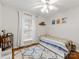 Cozy bedroom with natural light, ceiling fan, hardwood floors, and decorative accents at 3350 Bonneville Dr, Charlotte, NC 28205