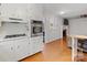 Open-concept kitchen featuring stainless steel appliances and a view into the adjacent living space at 3350 Bonneville Dr, Charlotte, NC 28205