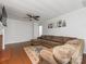 Spacious living room with a ceiling fan and hardwood floors adjacent to other rooms at 3350 Bonneville Dr, Charlotte, NC 28205