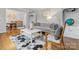 Open-concept living room with a cozy couch, stylish decor, and an adjacent dining space at 3350 Bonneville Dr, Charlotte, NC 28205
