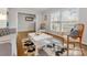 Sunlit living room with stylish decor, hardwood floors, and a doorway to another room at 3350 Bonneville Dr, Charlotte, NC 28205