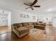 Spacious living room with hardwood floors and a ceiling fan adjacent to other rooms at 3350 Bonneville Dr, Charlotte, NC 28205