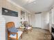 Sunroom featuring white brick walls, light floors, and a serene space with natural light at 3350 Bonneville Dr, Charlotte, NC 28205
