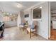 A sunroom with white brick walls and hardwood floors, offering a comfortable seating area at 3350 Bonneville Dr, Charlotte, NC 28205