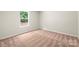 Empty bedroom showing a single window and neutral carpet at 3410 Saddlebred Dr, Gastonia, NC 28052