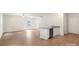 Living Room with a view of the kitchen island, hardwood floors, neutral walls, and a ceiling fan at 3410 Saddlebred Dr, Gastonia, NC 28052