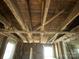 Exposed ceiling showing unfinished beams, framing, and an opportunity for custom design at 349 N Kendall N St, Norwood, NC 28128