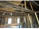 Interior view showcases exposed beams and windows, awaiting renovation and design at 349 N Kendall N St, Norwood, NC 28128