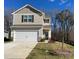 Charming two-story home featuring a spacious two-car garage and beautifully maintained front yard at 3540 Clover Valley Dr, Gastonia, NC 28052