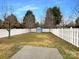 Spacious fenced backyard with a charming storage shed and ample green space at 3937 Northerly Island Ct, Gastonia, NC 28056