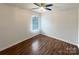 Bedroom featuring wood floors, white walls, ceiling fan and a window at 3937 Northerly Island Ct, Gastonia, NC 28056