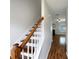 Bright entryway featuring hardwood floors, stairs with white risers and an open view into the living space at 3937 Northerly Island Ct, Gastonia, NC 28056