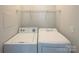 Functional laundry room with a washer and dryer set, designed for efficient home care at 3937 Northerly Island Ct, Gastonia, NC 28056