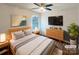 Serene main bedroom with wood floors, modern furniture, a ceiling fan and a window at 3937 Northerly Island Ct, Gastonia, NC 28056