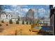 Spacious backyard with a wooden deck and a lush tree line, perfect for outdoor entertaining and relaxation at 4060 Steve Ikerd Ne Dr, Hickory, NC 28601