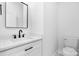 Modern half-bathroom featuring white fixtures and stylish black hardware accents at 4060 Steve Ikerd Ne Dr, Hickory, NC 28601