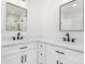 Bathroom with dual sinks, square mirrors, modern fixtures, and white marble flooring at 4060 Steve Ikerd Ne Dr, Hickory, NC 28601