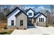 Eye-catching new construction featuring gray brick, white siding, a concrete driveway, and a welcoming front entrance at 4060 Steve Ikerd Ne Dr, Hickory, NC 28601