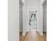 Bright hallway view into bathroom with marble floors, tub, and outside view at 4060 Steve Ikerd Ne Dr, Hickory, NC 28601