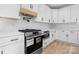 Modern kitchen features stainless steel appliances, white cabinets, and subway tile backsplash at 4060 Steve Ikerd Ne Dr, Hickory, NC 28601