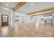 Spacious open-concept with hardwood floors, white walls, exposed beams, a kitchen island, and natural light at 4060 Steve Ikerd Ne Dr, Hickory, NC 28601
