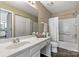 Bathroom featuring a bathtub with shower, vanity and framed mirror at 4139 N Course Dr, Charlotte, NC 28277