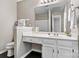 Bright bathroom with white vanity, large mirror and ample lighting at 4139 N Course Dr, Charlotte, NC 28277