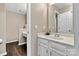 Well-lit bathroom features a sleek vanity with ample counter space at 4139 N Course Dr, Charlotte, NC 28277