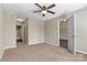 Bedroom with plush carpeting and en-suite bathroom, offering privacy and comfort at 4139 N Course Dr, Charlotte, NC 28277