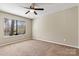 Bedroom with natural light, plush carpeting, and a modern ceiling fan at 4139 N Course Dr, Charlotte, NC 28277