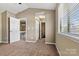 Comfortable bedroom featuring closet space, natural light, and neutral walls at 4139 N Course Dr, Charlotte, NC 28277