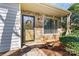 Welcoming front entrance with a decorative wreath and stone facade, offering a warm and inviting appeal at 4139 N Course Dr, Charlotte, NC 28277