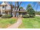 Charming townhome with stone accents, manicured lawn, and inviting walkway leading to the front door at 4139 N Course Dr, Charlotte, NC 28277